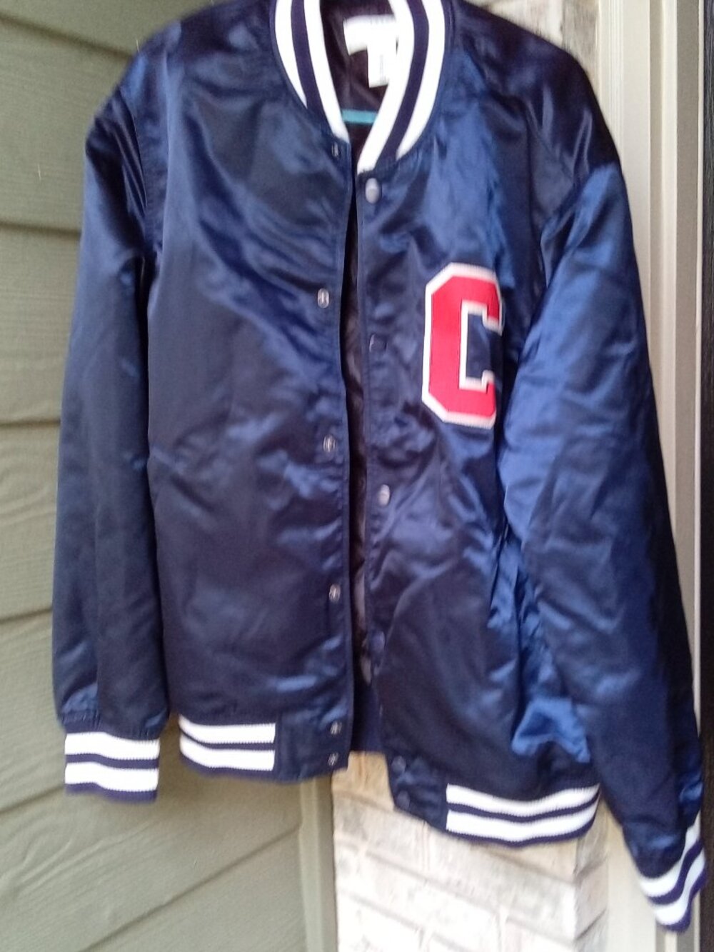 The Cleveland Guardians Indians Baseball Satin Jacket in navy blue